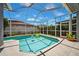 Inviting screened-in pool area with a sparkling pool and comfortable seating at 19750 Ellendale Dr, Land O Lakes, FL 34638