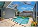 Private pool with a screened-in enclosure for year-round enjoyment at 19750 Ellendale Dr, Land O Lakes, FL 34638