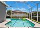 Screened-in pool area offers a refreshing escape on a sunny day at 19750 Ellendale Dr, Land O Lakes, FL 34638