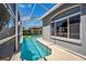 Beautiful pool with screened enclosure and tranquil backyard views at 19750 Ellendale Dr, Land O Lakes, FL 34638