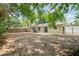 Spacious backyard featuring a home exterior with sliding glass doors, and a white privacy fence at 2207 Valleybrook Ave, Valrico, FL 33594