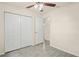 Bedroom with closet featuring views into the hall and bathroom, with a ceiling fan at 2207 Valleybrook Ave, Valrico, FL 33594
