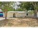 Charming single-story home with an arched entryway and well-maintained front yard and landscaping at 2207 Valleybrook Ave, Valrico, FL 33594
