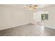 Bright living room showcasing modern tile flooring and an open design with natural light at 2207 Valleybrook Ave, Valrico, FL 33594