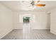 Bright living room showcasing modern tile flooring and an open design with natural light at 2207 Valleybrook Ave, Valrico, FL 33594