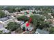 An aerial view showing a home surrounded by lush trees in a neighborhood setting with detached garage at 235 38Th S St, St Petersburg, FL 33711