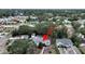 An aerial view showing a home surrounded by lush trees in a neighborhood setting with detached garage at 235 38Th S St, St Petersburg, FL 33711