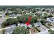 Charming home with a gray roof is nestled among lush trees and landscaping in a residential neighborhood at 235 38Th S St, St Petersburg, FL 33711