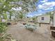 View of the backyard featuring a picnic table, seating, a basketball hoop, and an outdoor shed at 235 38Th S St, St Petersburg, FL 33711