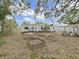 Backyard featuring raised garden beds, offering the perfect space for growing your own vegetables and plants at 235 38Th S St, St Petersburg, FL 33711