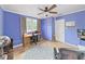 Bedroom with tile floor, fan, and closet space, offering a functional and comfortable layout at 235 38Th S St, St Petersburg, FL 33711