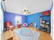 Bright bedroom with hardwood floors, ceiling fan and area rug at 235 38Th S St, St Petersburg, FL 33711