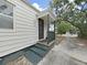 Inviting front porch with steps, offering a welcoming entrance to this charming home at 235 38Th S St, St Petersburg, FL 33711
