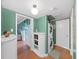 Functional laundry room setup with washer/dryer, storage, and access to additional rooms at 235 38Th S St, St Petersburg, FL 33711