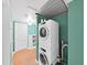 Laundry area with stacked washer and dryer, complementing the home's functionality at 235 38Th S St, St Petersburg, FL 33711