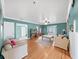 Bright and airy living room with hardwood floors, large windows, a ceiling fan, and comfortable furniture at 235 38Th S St, St Petersburg, FL 33711
