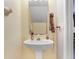 Bathroom with a pedestal sink and neutral wall color at 2418 Lake Woodberry Cir, Brandon, FL 33510