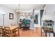 Dining area showcasing hardwood floors, contemporary decor and an adjacent workspace at 2418 Lake Woodberry Cir, Brandon, FL 33510