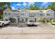 Exterior view of condos with parking and landscaping in the front at 2418 Lake Woodberry Cir, Brandon, FL 33510