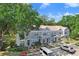 Charming townhome with a well-manicured lawn and lush trees in a desirable neighborhood at 2418 Lake Woodberry Cir, Brandon, FL 33510