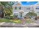 Charming townhome with a well-manicured lawn, tasteful landscaping, and inviting curb appeal at 2418 Lake Woodberry Cir, Brandon, FL 33510