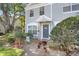 Inviting townhome entrance with landscaping and decorative touches at 2418 Lake Woodberry Cir, Brandon, FL 33510