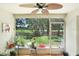 Relaxing screened-in lanai with views of the backyard and features several potted plants at 2418 Lake Woodberry Cir, Brandon, FL 33510