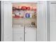 Cozy laundry room with washer, dryer, and shelving unit to store items in the space at 2418 Lake Woodberry Cir, Brandon, FL 33510