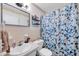 Bathroom featuring tile details, a shower with curtain, and a sink with a mirror at 2452 Brazilia Dr # 32, Clearwater, FL 33763