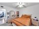 Bedroom featuring a large mirror and dresser with drawers, plus a window for plenty of natural light at 2452 Brazilia Dr # 32, Clearwater, FL 33763