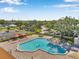 A beautiful community pool with ample lounging areas and green spaces at 2452 Brazilia Dr # 32, Clearwater, FL 33763