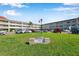 A condominium complex with well-manicured green lawn and visible signage out front at 2452 Brazilia Dr # 32, Clearwater, FL 33763