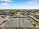 A shuffleboard court sits next to some parking, a tennis court and lawn area at 2452 Brazilia Dr # 32, Clearwater, FL 33763