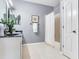 Cozy bathroom with a sink, white cabinets, and shower with curtain at 30340 Elderwood Dr, Wesley Chapel, FL 33543