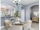 Charming dining room with a glass-top table, seating for six, and an open layout at 30340 Elderwood Dr, Wesley Chapel, FL 33543