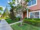 Attractive townhome row with well-maintained lawns, fresh landscaping, and inviting curb appeal at 30340 Elderwood Dr, Wesley Chapel, FL 33543