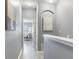 Upstairs hallway features light-colored walls and trim with an open doorway to a bedroom at 30340 Elderwood Dr, Wesley Chapel, FL 33543