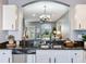 Bright, open kitchen with granite countertops overlooking the living room, perfect for entertaining at 30340 Elderwood Dr, Wesley Chapel, FL 33543