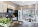 Well-lit kitchen featuring granite counters, stainless appliances, and an eat-in breakfast nook at 30340 Elderwood Dr, Wesley Chapel, FL 33543