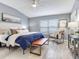Relaxing main bedroom with lots of natural light, light-colored walls, and hardwood floors at 30340 Elderwood Dr, Wesley Chapel, FL 33543