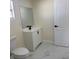 Bathroom with modern vanity, black faucet, and door at 3301 Clydesdale Dr, Holiday, FL 34691