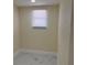Small bedroom with a window and tiled floors at 3301 Clydesdale Dr, Holiday, FL 34691