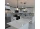 Modern kitchen featuring stainless steel appliances and white cabinets at 3301 Clydesdale Dr, Holiday, FL 34691