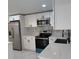 Modern kitchen featuring stainless steel appliances and quartz countertops at 3301 Clydesdale Dr, Holiday, FL 34691
