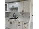 Kitchen sink and new cabinets with quartz countertop at 3301 Clydesdale Dr, Holiday, FL 34691