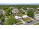 Aerial view of a home surrounded by mature trees and a well-maintained neighborhood at 4003 W Bay Ave, Tampa, FL 33616