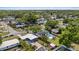 Aerial view of a property showcasing its landscaped yard, pool, and neighborhood at 4003 W Bay Ave, Tampa, FL 33616