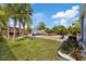 Backyard features lawn, pool, hot tub, landscaping, shed, and outdoor seating area at 4003 W Bay Ave, Tampa, FL 33616