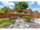 Inviting backyard pergola with wooden structure and outdoor seating area at 4003 W Bay Ave, Tampa, FL 33616