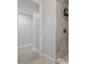 Shower featuring marble tile and modern fixtures at 4003 W Bay Ave, Tampa, FL 33616